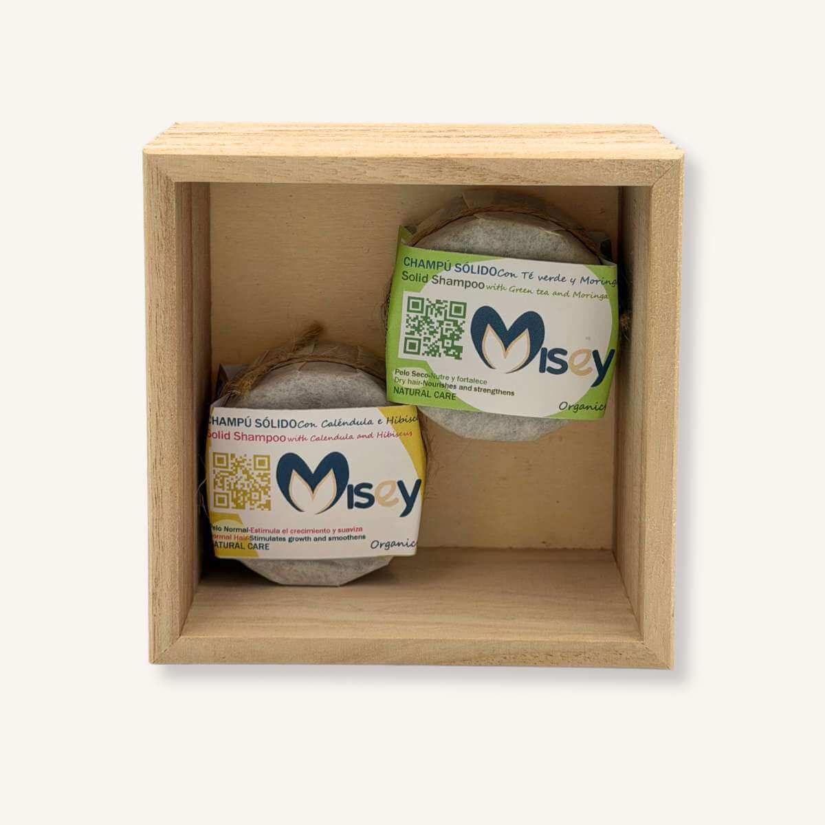 Pack dúo de champús sólidos de Misey (Caléndula y Té Verde) presentados en una caja de madera sostenible, ideal para regalo zero waste.